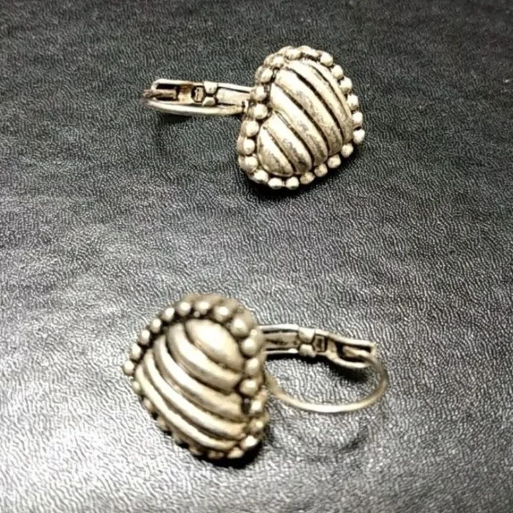 Silver tone heart earrings textured dangling